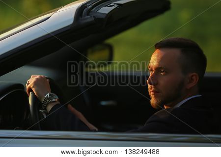 Portrait of a businessman, Businessman by car, portrait of a man, driving a convertible