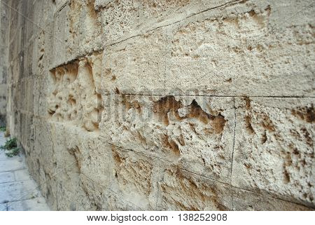 fortified wall with heavily weathered brick castle in Rhodes