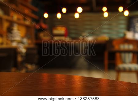 curve wood table surface with blur bar or cafe scene at night background