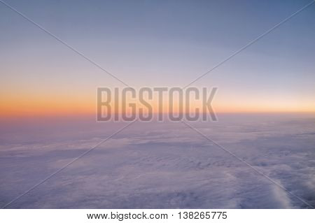 Sky above cloud sea cloud view from the window of an airplane