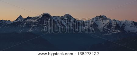 View from Mt Niederhorn Beatenberg. High mountains Eiger Monch and Jungfrau. Morning scene.