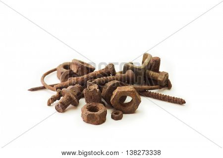 Heavily rusted nuts and bolts, screws and nails, isolated on white.