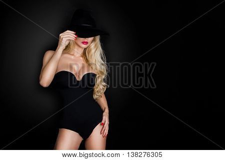 Beautiful Blond Woman Girl Sexy Model Dressed In Black Lingerie Outfit Body Swimsuit And Black Hat A