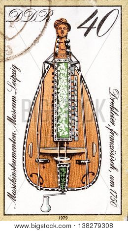 MOSCOW RUSSIA - CIRCA JANUARY 2016: a post stamp printed in DDR shows a musical instrument 