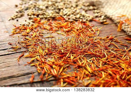 Different spices on wooden background, close up