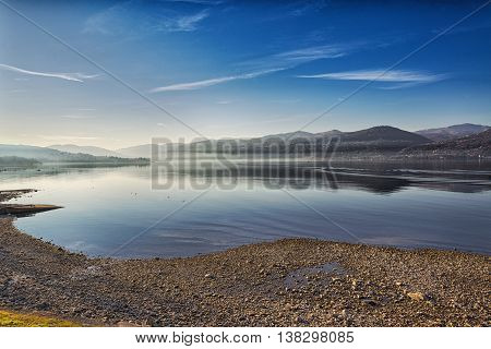 Landscape on the Major Lake in a quiet winter afternoon with fog at the horizon Ispra - Varese Lombardy - Italy