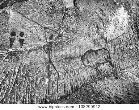 Buffalo Hunting. Paint Of Human Hunting On Sandstone Wall, Prehistoric Picture.