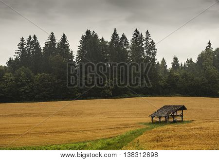 Traditional Slovenian structure used for storing farming tools drying corn and other farm tools