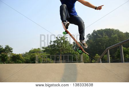 closeup of one skateboarder at skate park ramp