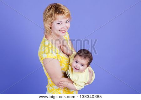 Mama embraces his cute daughter family happy