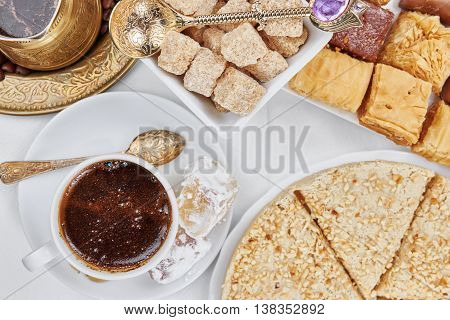 Traditional Turkish black coffee and sweet dainties