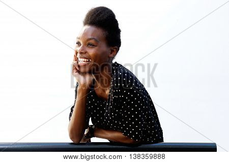 Smiling Young African Lady Leaning On Railing