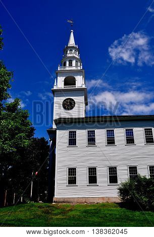 Fitzwilliam New Hampshire - July 11 2013:  Colonial 1775 Original Meeting House church with its elegant tiered steeple and clock