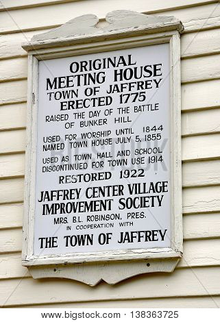 Jaffrey Center New Hampshire - July 11 2013: Town of Jaffrey historic sign on the 1775 Original Meeting House church