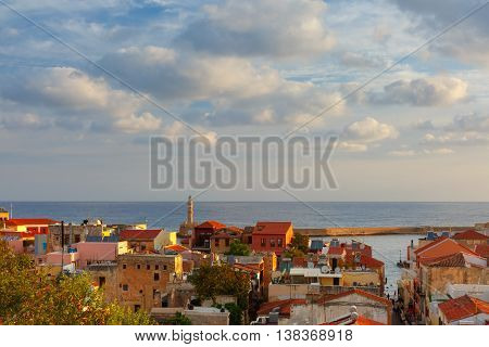The medieval city with lighthouse in old harbour, aerial view from Schiavo Bastion in the evening, Crete, Greece