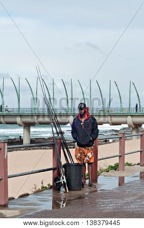 DURBAN SOUTH AFRICA - JULY 09 2016: Fisherman at the beach near the Millennium Pier in Umhlanga Rocks