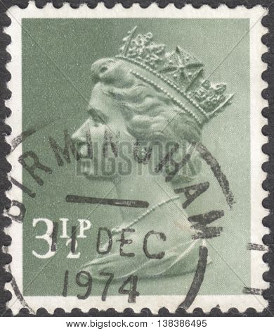 MOSCOW RUSSIA - JANUARY 2016: a post stamp printed in the UNITED KINDOM shows a portrait of Portrait of Queen Elizabeth II circa 1970 - 1977