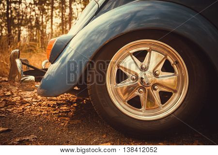Vintage Car Volkswagen Retro Blue Color In Forest Leaves Brown