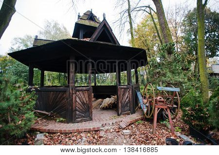 Black Old Wooden Summerhouse At Autumn Yard