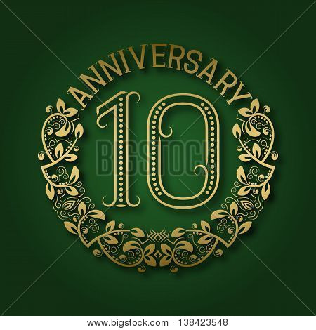 Golden emblem of tenth anniversary. Celebration patterned logotype with shadow on green.