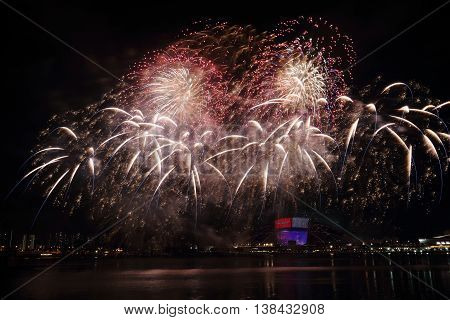 Fireworks celebrating Singapore's National Day across the Kallang River