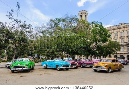 HAVANA, CUBA - MARCH 17, 2016: Old cars parking near Central Park in Havana the capital of Cuba