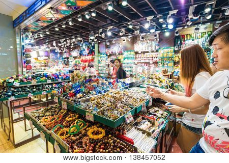 HONG KONG CHINA - OCT 23: People shopping souvenir on market of The peak on october 23 2015 in Hong Kong. Offers breathtaking views of the harbour and city. This is Hong Kong's must-see.