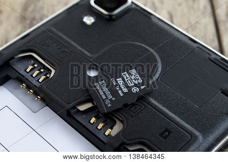 BUNG KAN THAILAND - APRIL 04 2016: micro sd card on top of smart phone soft focused