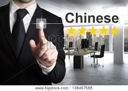 businessman translator in modern office pushing button chinese
