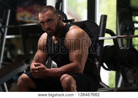 Bodybuilder Resting At The Bench