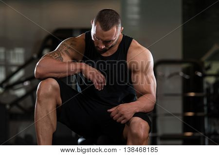 Bodybuilder Resting At The Bench