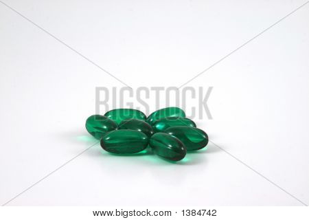 Green Gelcaps On A White Background