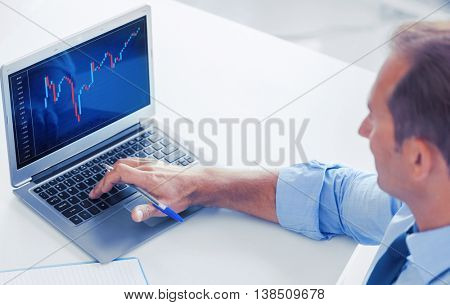 business, office and money concept - smiling businessman working with forex chart in office
