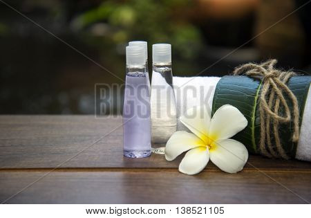 Spa massage compress balls, herbal ball on the wooden with treaments spa , Thailand, soft focus