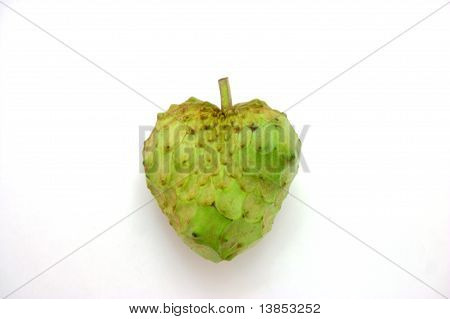 Heart shaped cherimoya fruit on white
