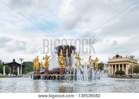 MOSCOW RUSSIA - July 08 2016 Fountain "Friendship of the people" at VDNH ("The Exhibition of achievements of national economy"). Golden statues of women represent republics in the USSR.