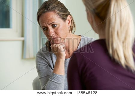 Unhappy Mature Woman Discussing Problems With Counselor