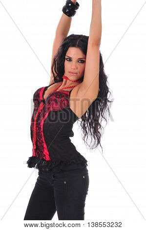 Sexy brunette in a red corset with her hands up