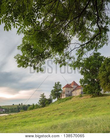 Evening landscape with a castle in Svirzh, Ukraine