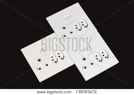 Electric Wall Mount Sockets And Switches On Black Background