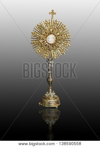 A Catholic priest santisimo host at Communion and face of Jesus