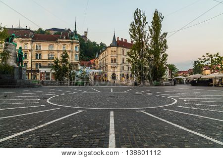 LJUBLJANA SLOVENIA - 27TH MAY 2016: A view towards Town Square Ljubljana Castle and Triple bridges during the morning from Preseren Square. Buildings can be seen.