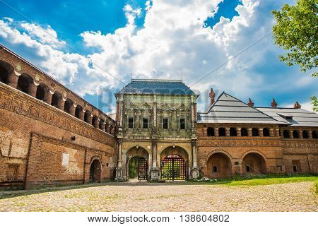 Krutitsy Patriarchal Metochion. The Old Brick Church On A Blue Sky With Clouds. Moscow, Russia.