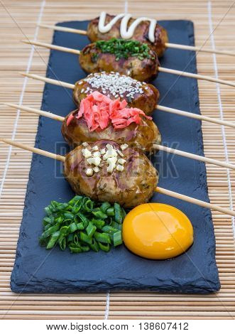Tsukune Japanese chicken meatballs with scallimons and yolk