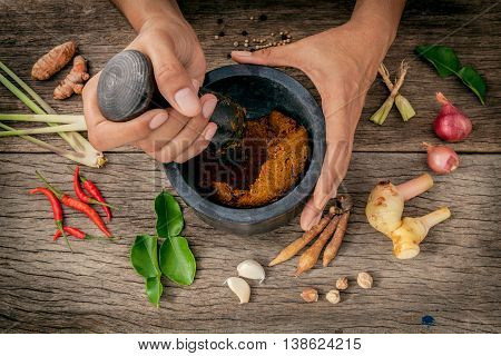 The Women Hold Pestle With Mortar And Spice Red Curry Paste Ingredient Of Thai Popular Food On Rusti