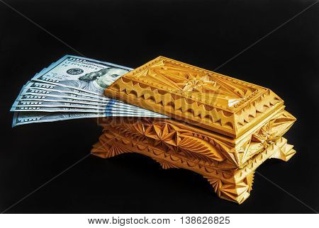 Carved wooden box handmade note storage on a black background