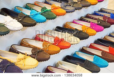 variety of the colorful leather shoes in the shop 