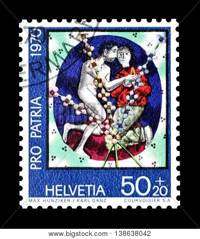 SWITZERLAND - CIRCA 1970 : Cancelled postage stamp printed by Switzerland, that shows Man and wife by Max Hunziker and Karl Ganz.