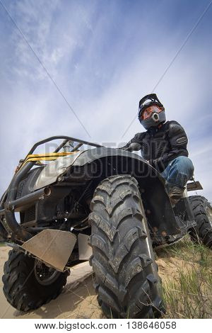 Racing ATV on the sand in summertime.
