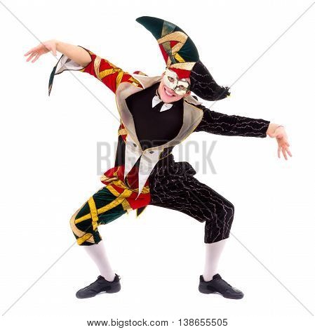 Smiling harlequin wearing a mask, isolated on white background in full length.